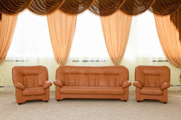 stock image Leather armchairs and a sofa