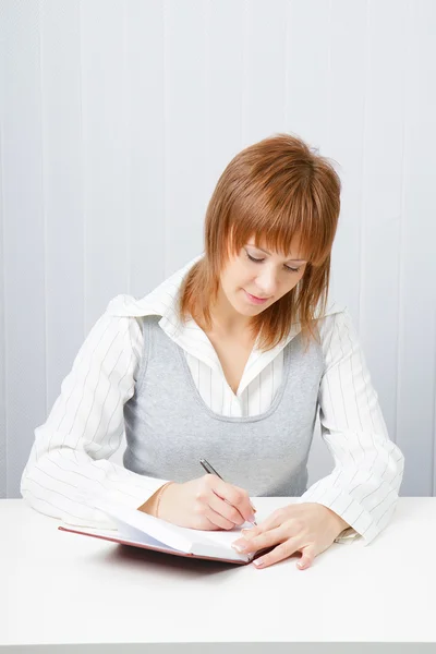 stock image Attractive girl with a notepad and pen