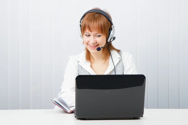 Girl with laptop in headphones Royalty Free Stock Images