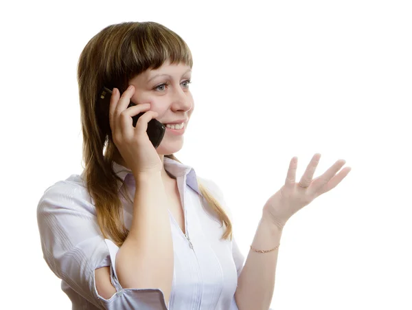 Ung kvinna talar i en mobiltelefon — Stockfoto