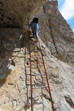 Climbing on metal ladder clipart