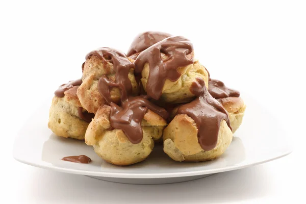 Plate with profiteroles — Stock Photo, Image