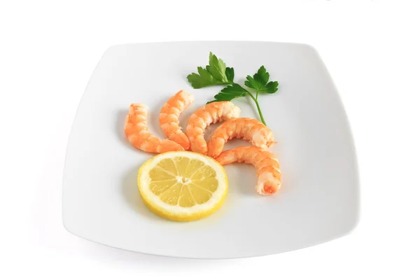 Five shrimps with lemon — Stock Photo, Image