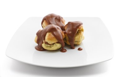 Three chocolate profiteroles clipart