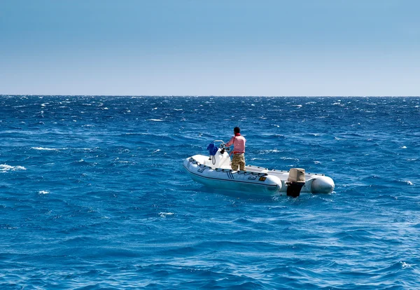 stock image The man in a boat on the sea
