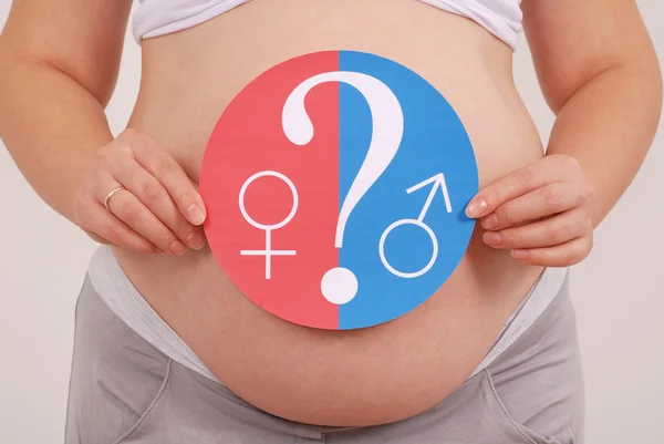 Pregnant woman tries to guess the sex of a child — Stock Photo, Image