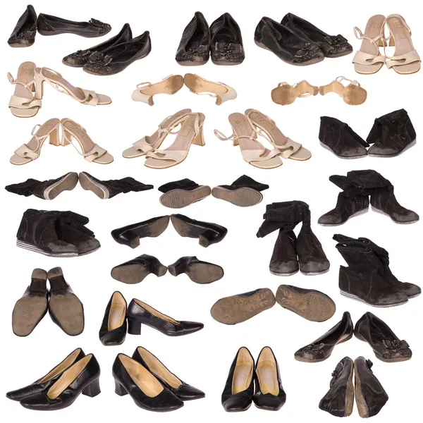 Veel oude laarzen op wit — Stockfoto