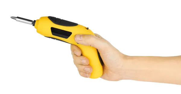 Mão segurando chave de fenda amarela — Fotografia de Stock