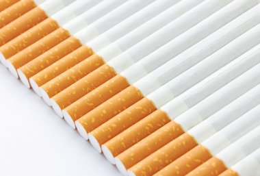 Closeup of a pile of cigarettes clipart