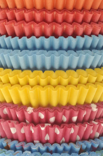 Pila di involucri di cupcake vibranti — Foto Stock