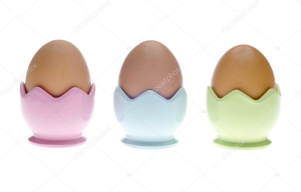 Three Pastel Egg Cups with Brown Eggs