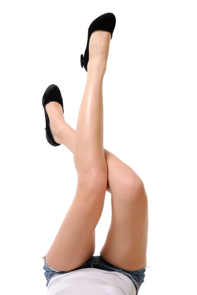 Довгі красиві жіночі ноги ізольовані на білому тлі — стокове фото