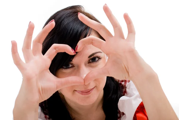 Young woman shows fingers heart symbol isolated in white backgro — Stock Photo, Image