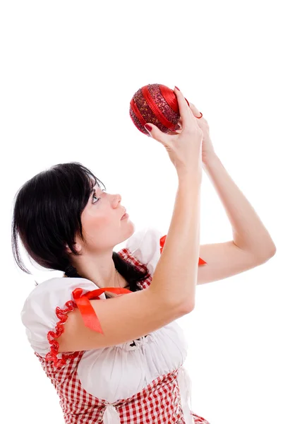 Attractive woman holding christmas red ball on white background — Stock Photo, Image