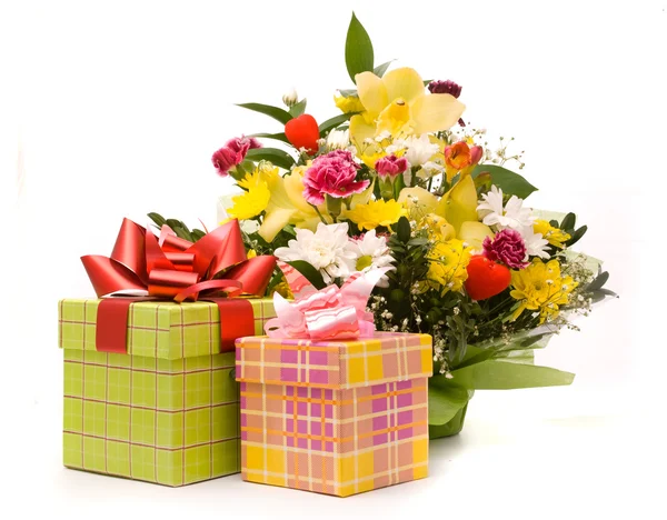 Magnificent bouquet and present boxes on a white — Stock Photo, Image