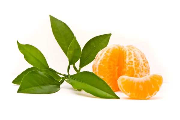 stock image Juicy tangerine and leaves isolated on a white background.