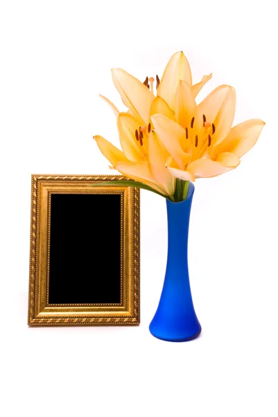 Yellow lily and gold frame on a white background — Stock Photo, Image
