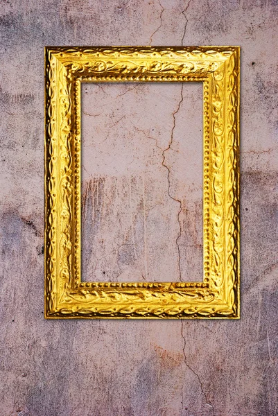 Cornice in oro su un vecchio sfondo della parete — Foto Stock