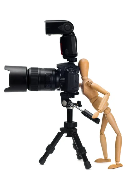 The wooden figure of photographer who photographed SLR camera — Stock Photo, Image