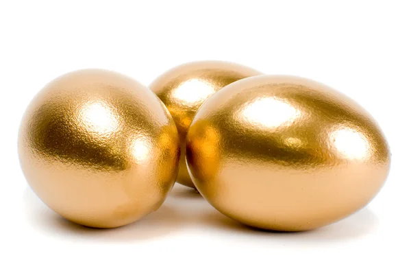 Gouden eieren. een symbool van het maken van geld en succesvolle investeringen — Stockfoto