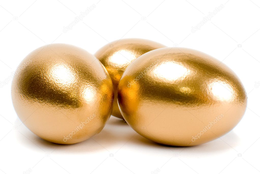 Golden eggs. A symbol of making money and successful investment on green  background Stock Photo - Alamy