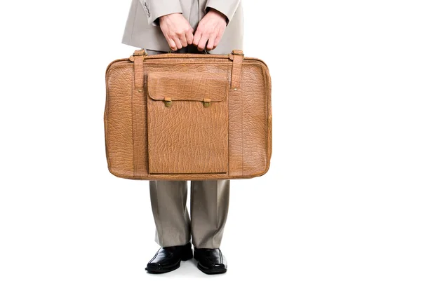 stock image Man holding an old suitcase isolated over white background