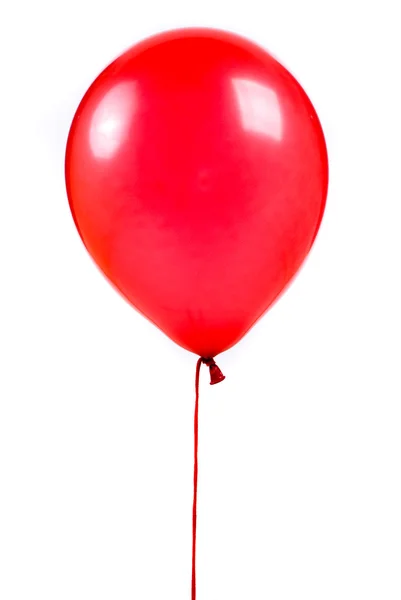 Červený balón na bílém pozadí — Stock fotografie