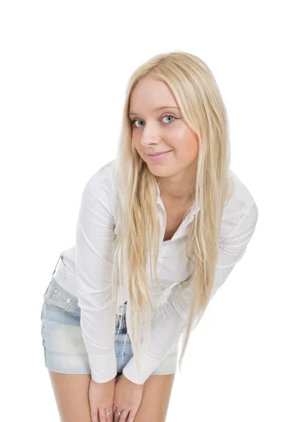 Young blonde woman in denim skirt. Isolated on white background — Stock Photo, Image