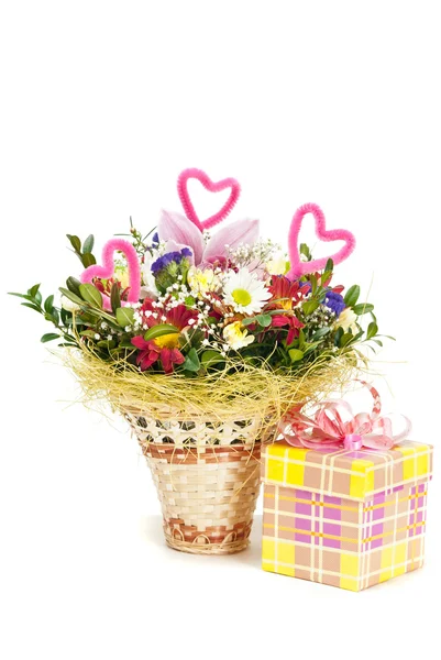 Beautiful bouquet in the basket and present box on a white backg — Stock Photo, Image