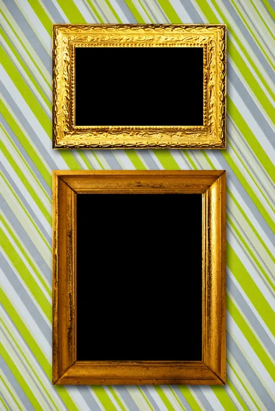 Gold frame on striped vintage wallpaper background — Stock Photo, Image