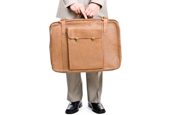 stock image Man holding an old suitcase isolated over white background