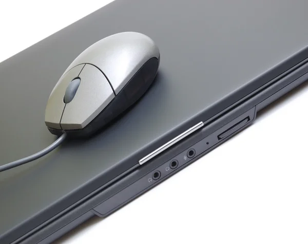 Silver mouse on a black laptop. IT style. — Stock Photo, Image