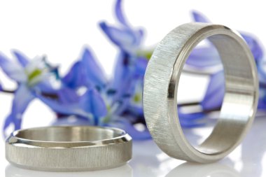 Rings with flowers in the background clipart