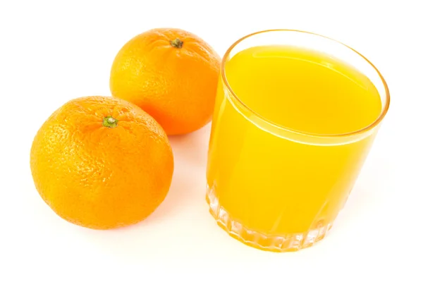 Mandarines와 주스 유리 — 스톡 사진