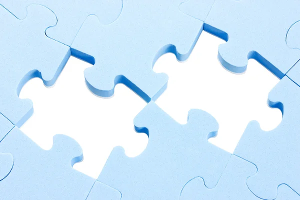 Puzzle background with two missing pieces — Stock Photo, Image