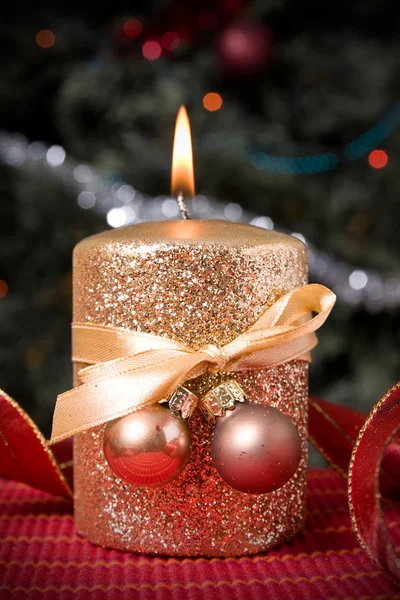 Burning gold festive candle — Stock Photo, Image