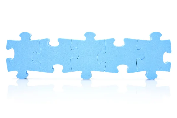 Five puzzle pieces connected in a row — Stock Photo, Image