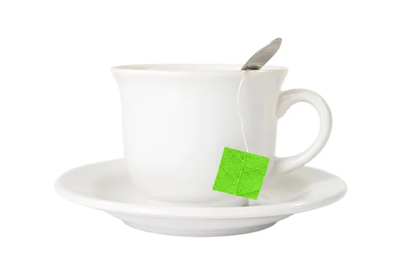 White tea cup with green leaf label — Stock Photo, Image