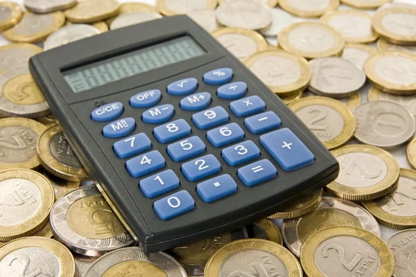 Calculator with coins — Stock Photo, Image