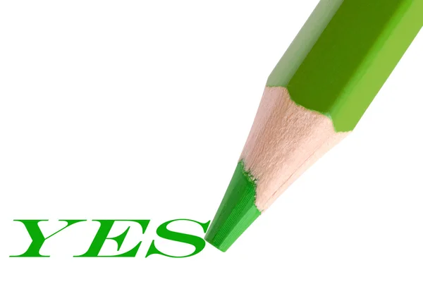 Green pencil writing word "yes" — Stock Photo, Image