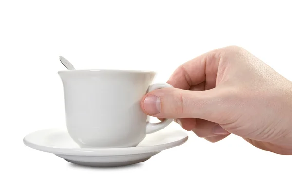 Hand und Teetasse mit plate — Stockfoto