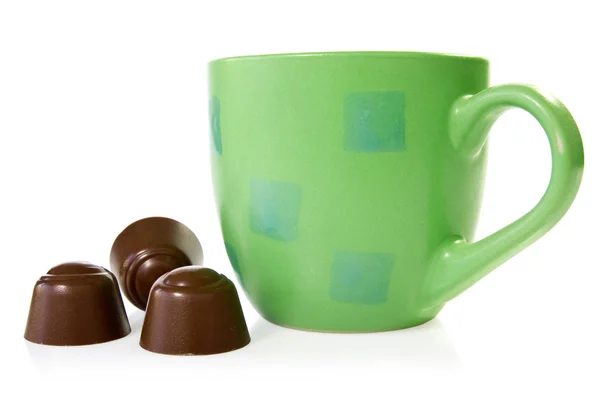 Coffee cup with chocolate pralines — Stock Photo, Image