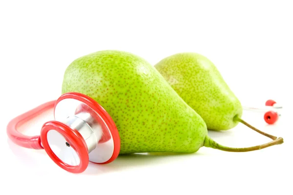 Pears and stethoscope — Stock Photo, Image