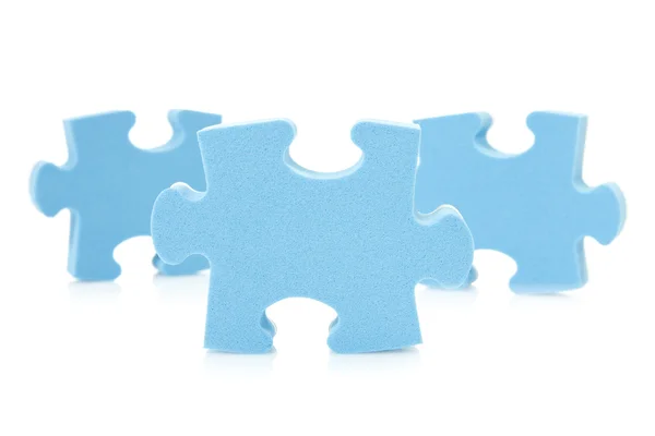 Trois pièces de puzzle bleu — Photo