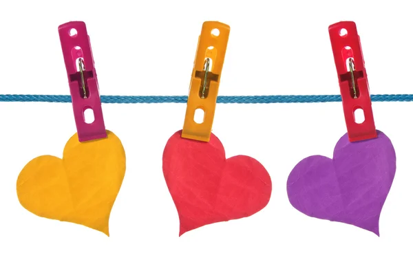 Color paper hearts hung on clothesline — Stock Photo, Image