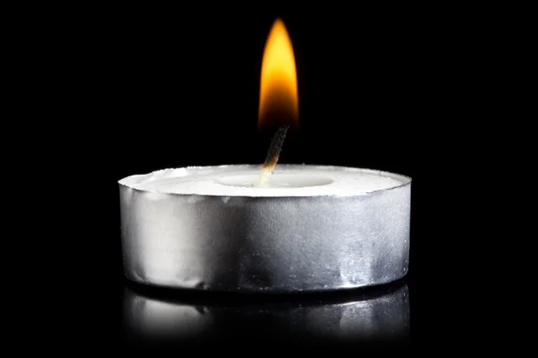 Burning candle in darkness — Stock Photo, Image