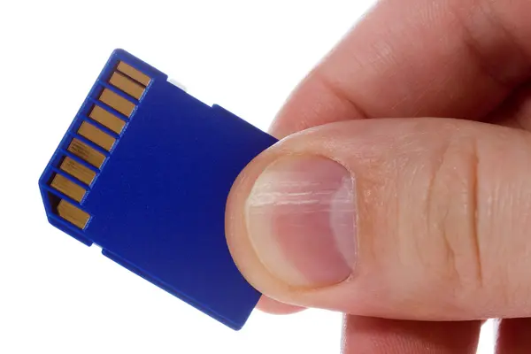 stock image Hand with blue sd memory card