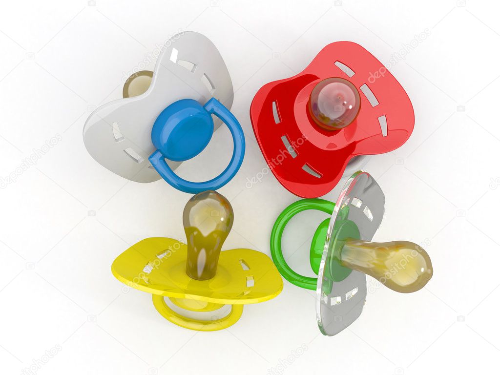 Baby's pacifiers on white isolated background.