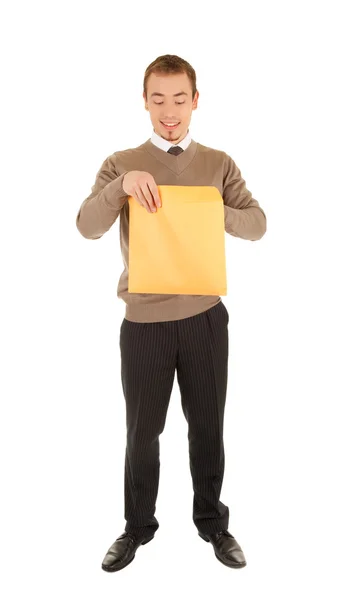 Young man opens a post package — Stock Photo, Image