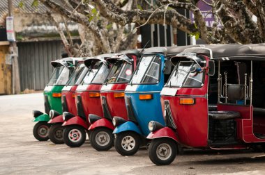 Tuk-tuk is a popular asian transport as a taxi. clipart